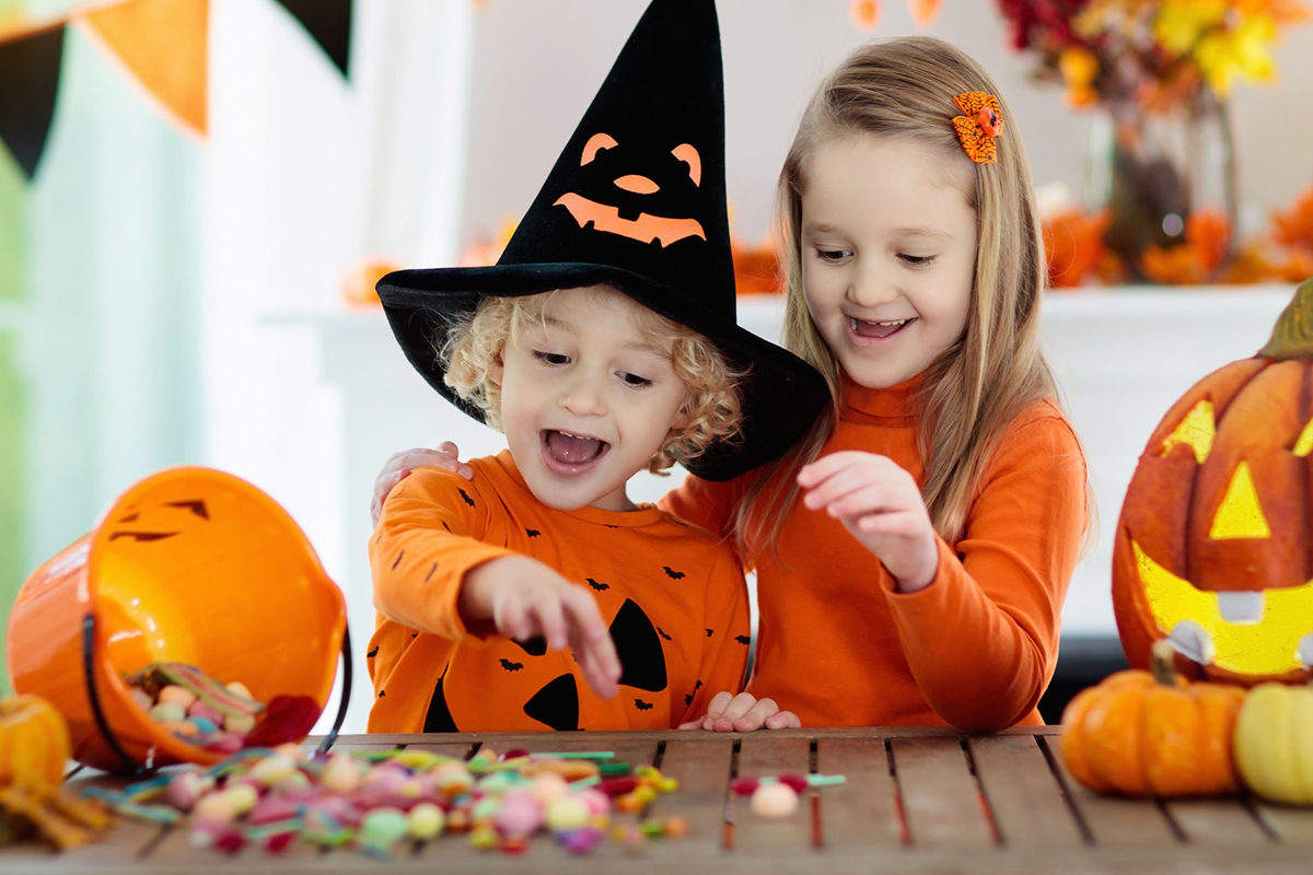 little girls look at halloween candy
