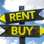 sign pointing in 2 directions reading rent or buy