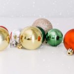 shiny christmas tree ornaments on white background