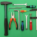 household tools isolated on green background
