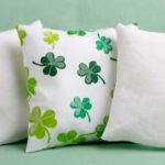 shamrock pillow sits on green couch