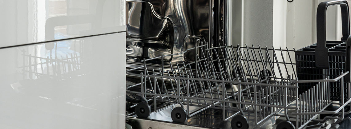 empty dishwasher open with racks
