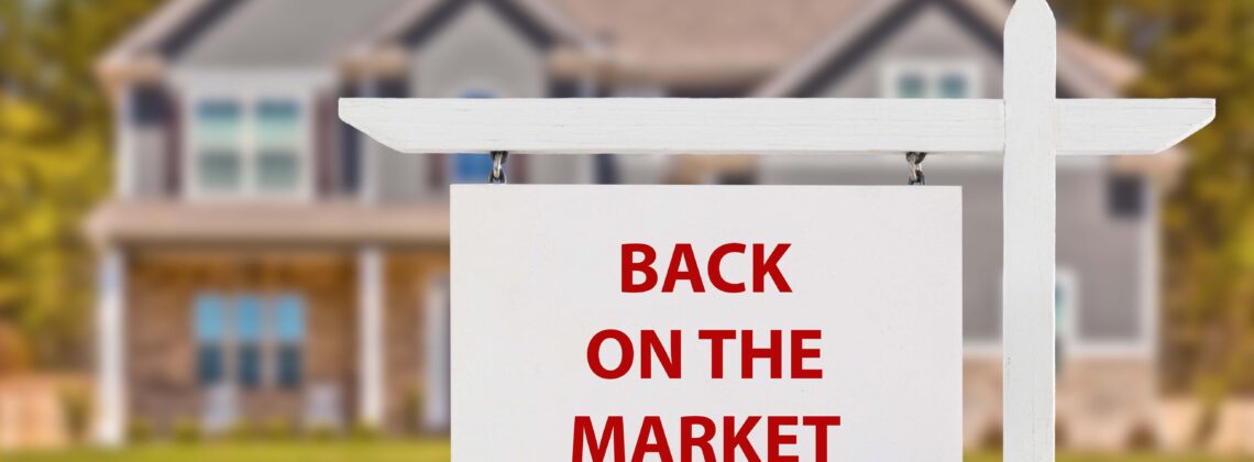 Sign in front of house saying "back on the market"