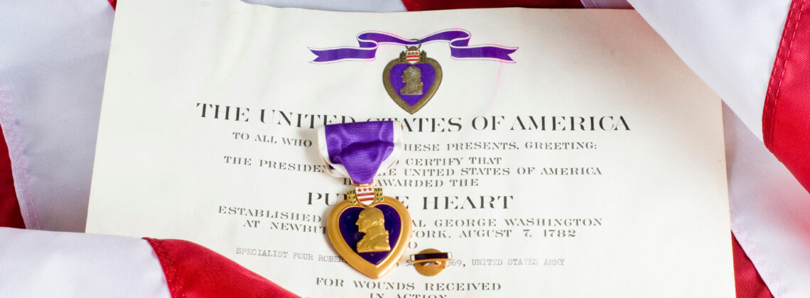 Purple Heart medal with certificate and American flag
