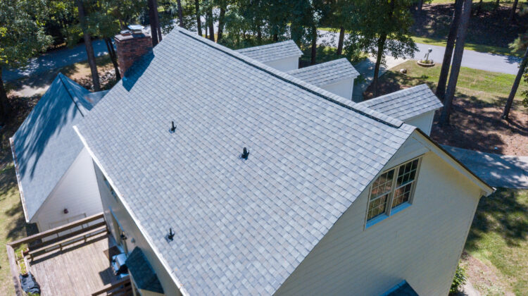 house in the woods with a new roof
