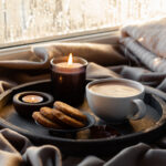 cozy window with hot cocoa, cookies and a candle