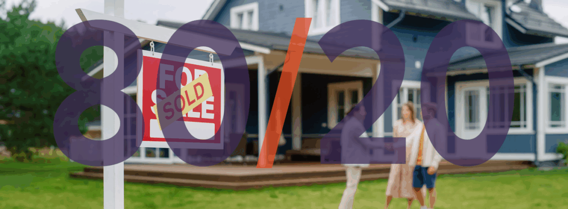 Real estate agent shaking hands with clients in front of a home with a SOLD sign
