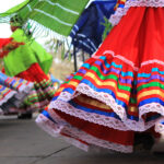 Cinco de Mayo celebration with colorful skirts and dancing